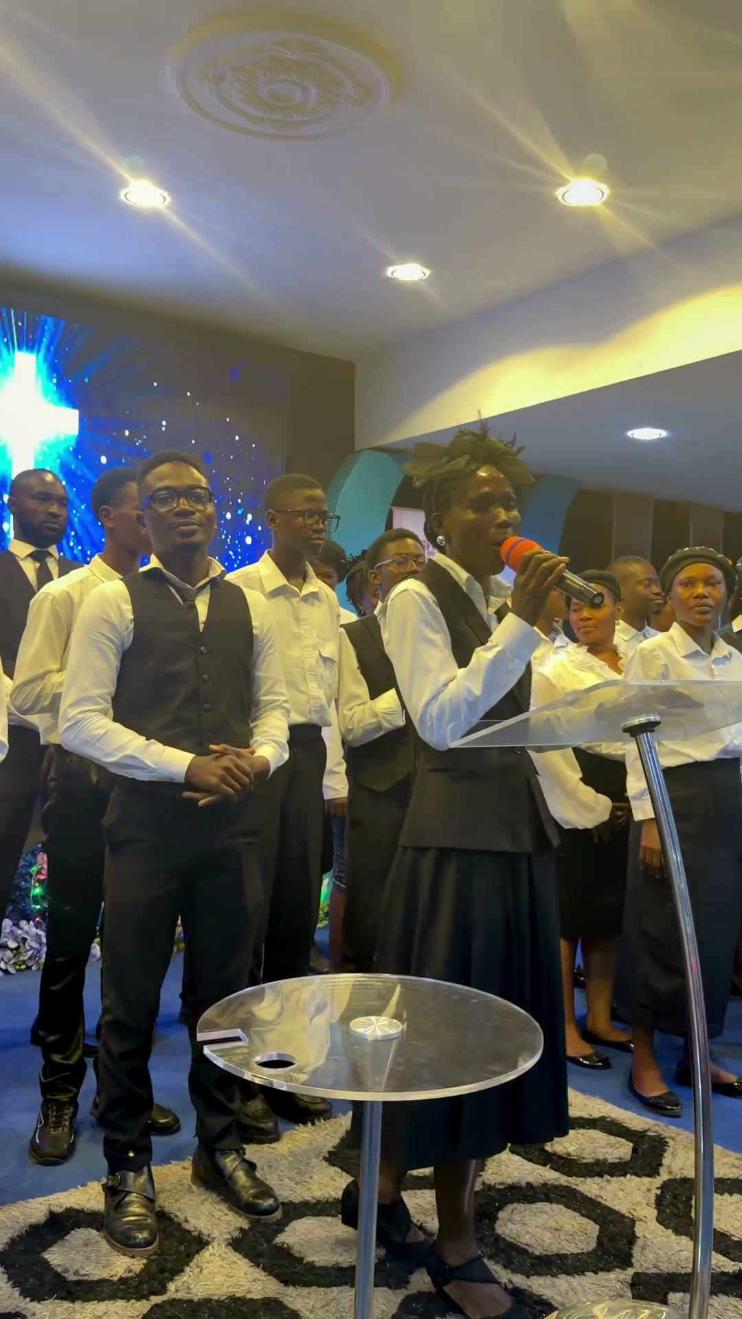 The choir beneath the cross and the congregation celebrating at Ilupeju Foursquare Gospel Church